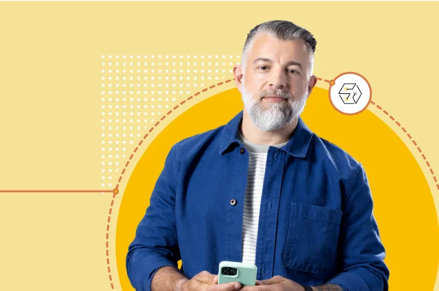 Homme avec un air pensif, tenant un téléphone